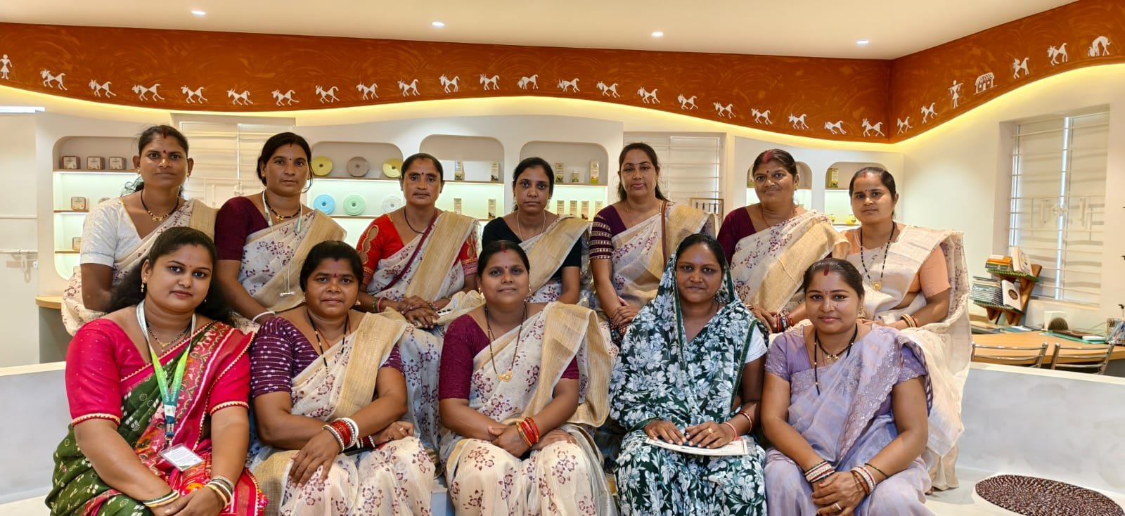Farmers gathering under a tree — Together we grow, together we prosper